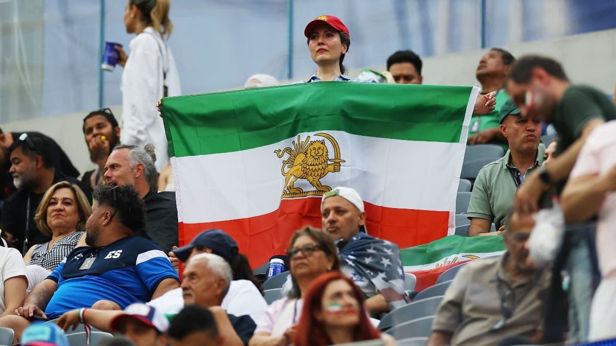 Iran supporters turn up in numbers with banned ‘Lion and Sun’ flag